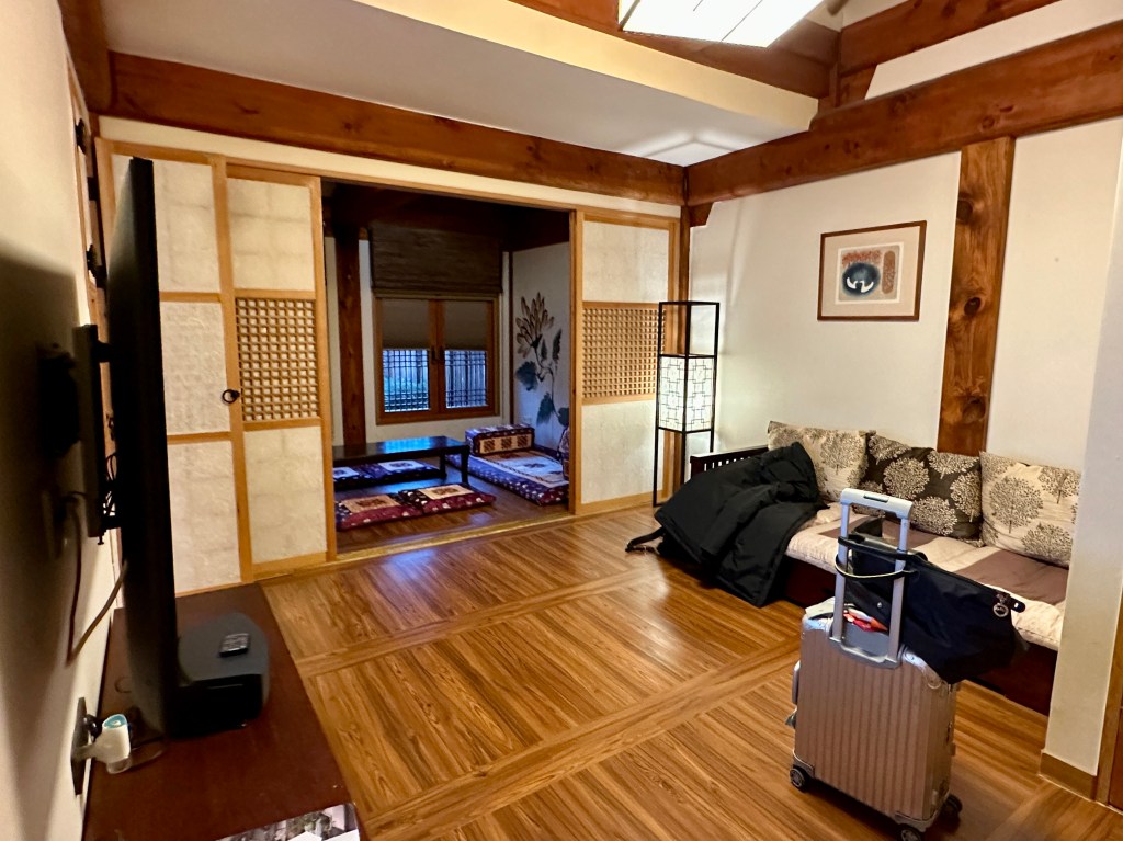 Interior view of a hanok-style hotel room at Gyeongwonjae by Walkerhill, showcasing traditional Korean architecture and modern amenities.